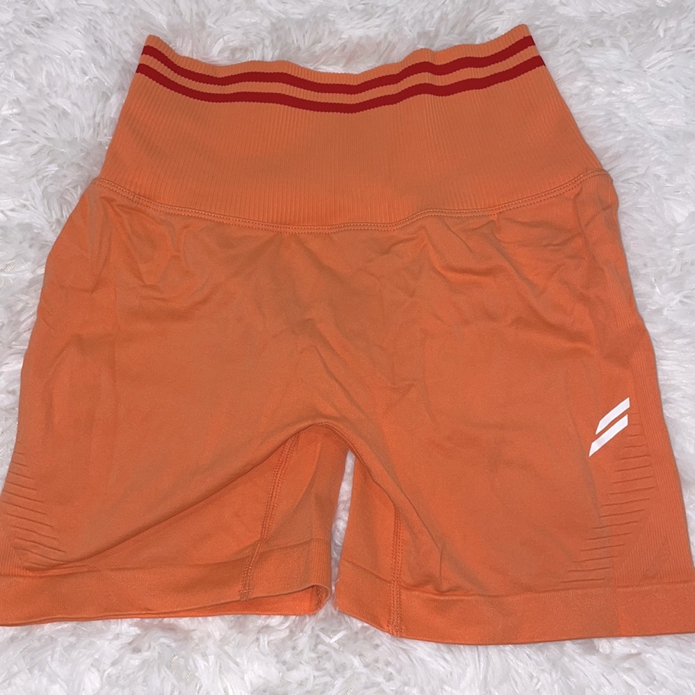 Coral/orange colored doyoueven seamless scrunch shorts